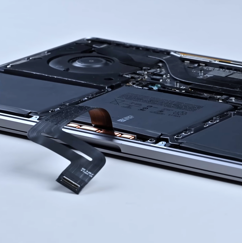 open macbook laptop with its battery freshly replaced with a genuine apple part